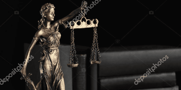 Symbol of fair treatment under law. Statue of Lady Justice near books and gavel on wooden table, space for text.